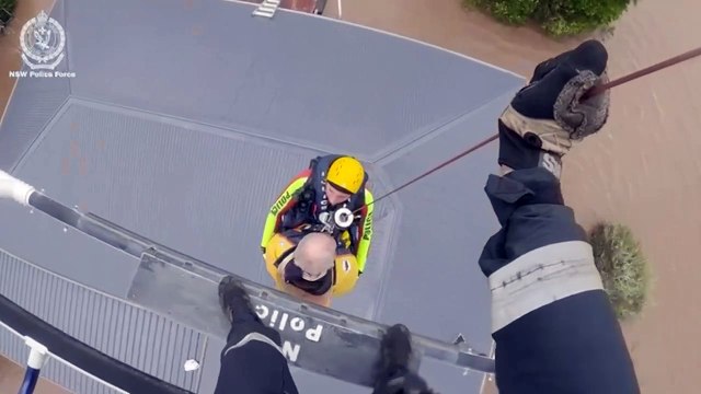 Australians rescued off rooftops amid deadly floods