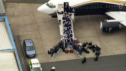 Spurs players return to the UK with Europa League trophy