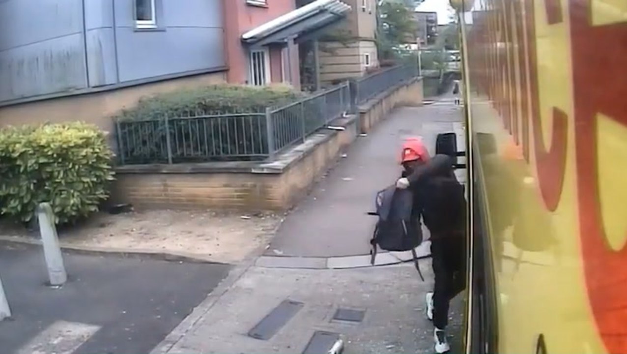 Watch moment brazen thief wrecks ambulance before stealing paramedics’ bag as they treat patient