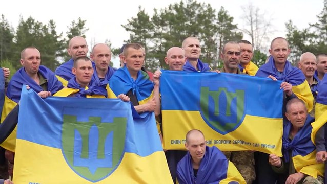 Ukrainian prisoners of war embrace loved ones in emotional reunion after Russia prisoner swap