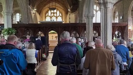 Singing one of the hymns during the Act of Re-Dedication of the Edward V Window service at Coldridge, video Alan Quick IMG_2541