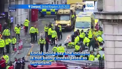 Dozens injured after car strikes crowd during Liverpool FC title celebration