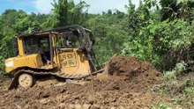 The D6R XL Bulldozer Action Cutting the Hill for Road Widening