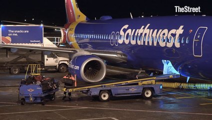 Southwest to officially start charging for checked bags