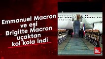 Emmanuel Macron ve eşi Brigitte Macron uçaktan kol kola indi