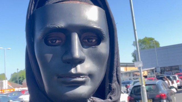 Masked man hands out chocolates but people avoid him completely