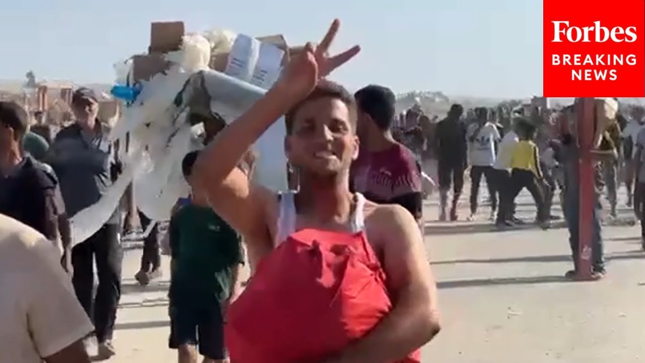 Palestinians Depart Aid Site In Gaza Carrying Humanitarian Aid