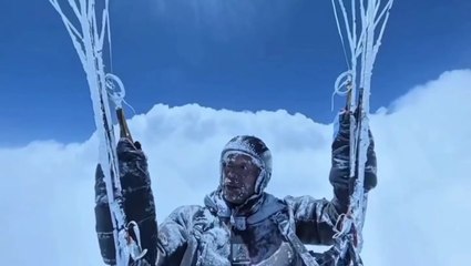 Paraglider accidentally soars above the clouds in death-defying icy flight caught on camera