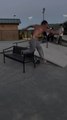 Skateboarder Struggles to Crook Bench Rail