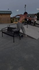 Skateboarder Struggles to Crook Bench Rail