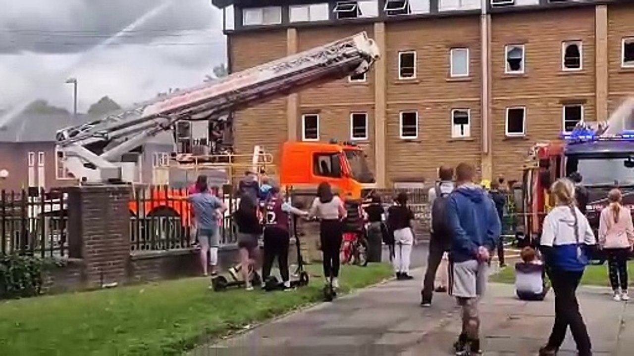 Firefighters at the scene of the blaze in Holmes Street, Burnley, this afternoon