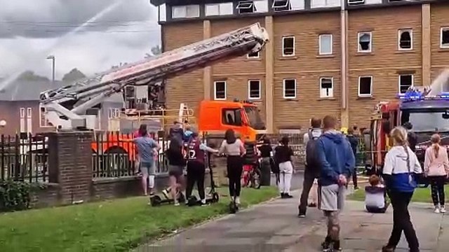 Firefighters at the scene of the blaze in Holmes Street, Burnley, this afternoon