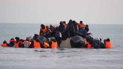 Watch: Migrants cling to overloaded small boat as over 1,000 cross Channel in one day