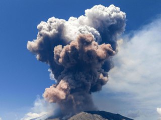 Smoke rising from Italy's Etna volcano as it erupts