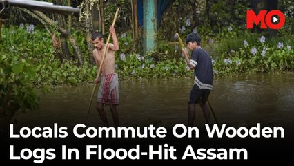 Locals commute on wooden logs in flood-hit Assam