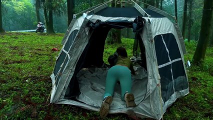 Young girl camping alone in the forest for fun and relaxation part 1