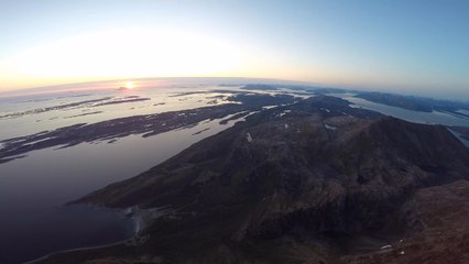 Amazing Drone View of Midnight Sun on Mountain Peak in Norway