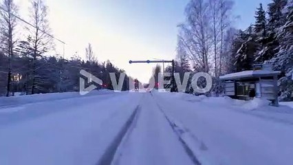 POV shot driving along a rural snowcovered Helsinki road