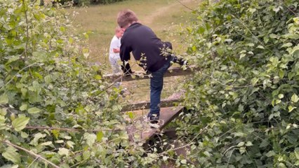 Clumsy kid tries catching up with his brother but falls down