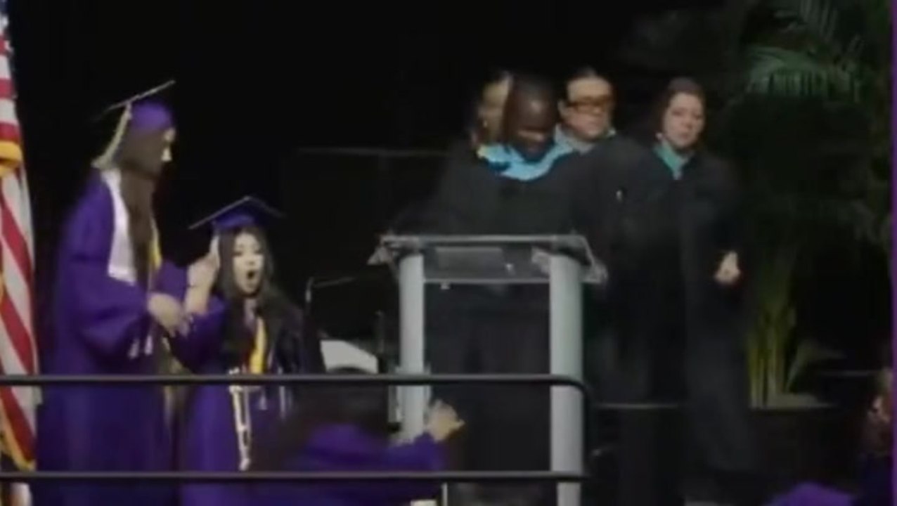 Watch: Celebrating student accidentally kicks girl in the face doing backflip at graduation ceremony