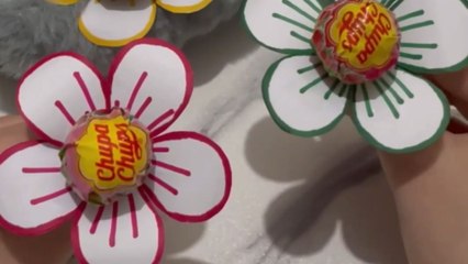 This DIY project uses paper flowers as fun candy holders for kids