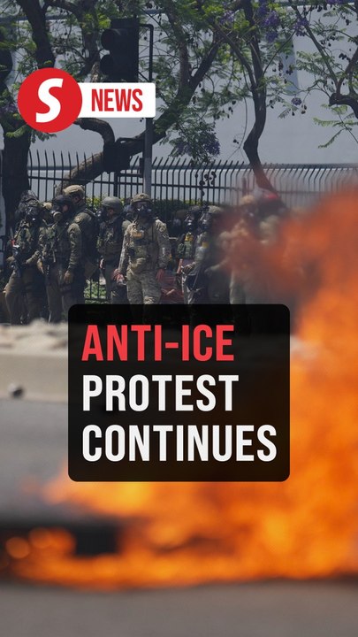 Federal agents and anti-ICE protesters face off in LA as street fires burn
