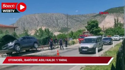 Bariyere asılı kaldı