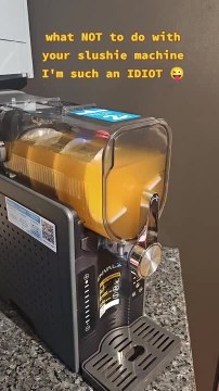 Woman Spills Slushie Mix While Using Machine