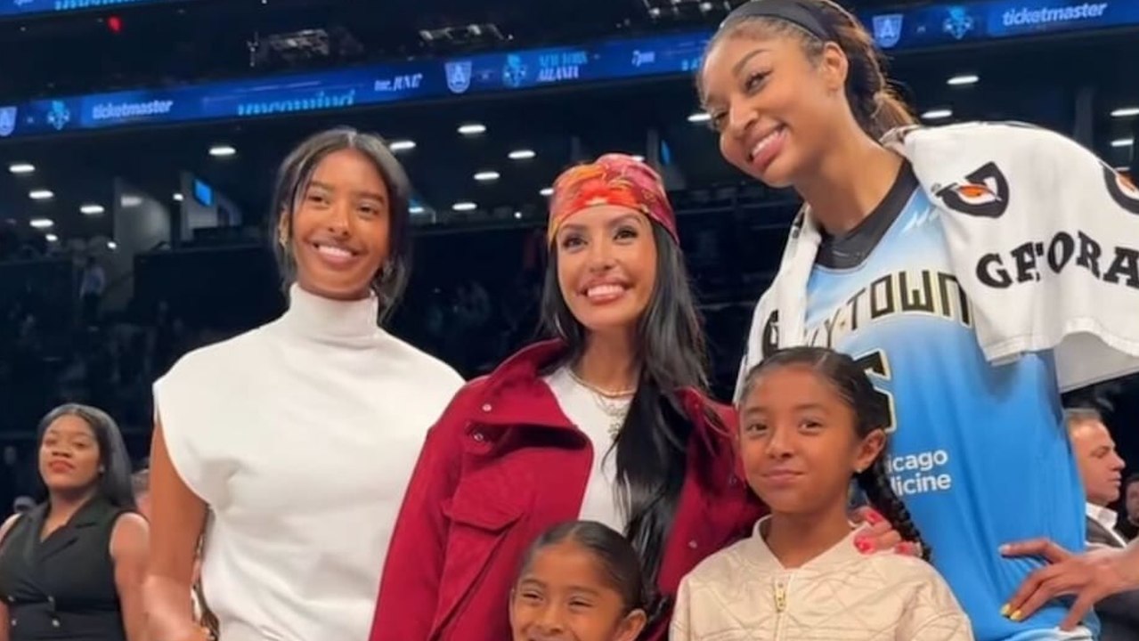 Angel Reese and Sabrina Ionescu postgame with the Bryant family