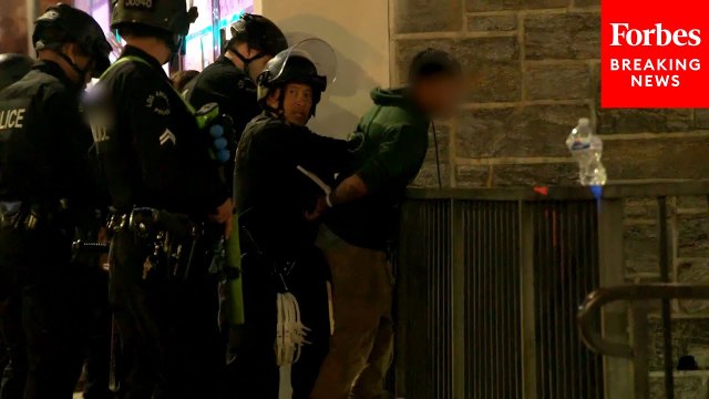 People Are Detained By Law Enforcement In The Downtown Curfew Zone In Los Angeles