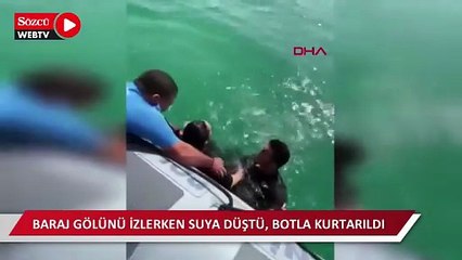 Baraj gölünü izlerken suya düştü, botla kurtarıldı