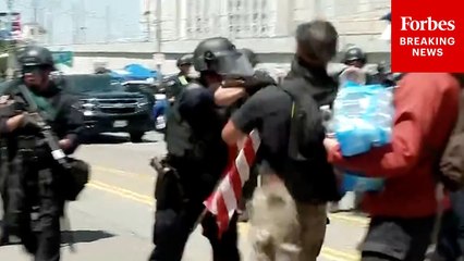 Face-Off Between Anti-ICE Demonstrator And LAPD Leads To Physical Confrontation