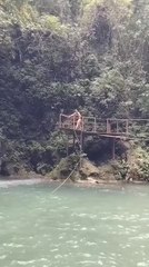 Girl Slips While Jumping Into River from Deck