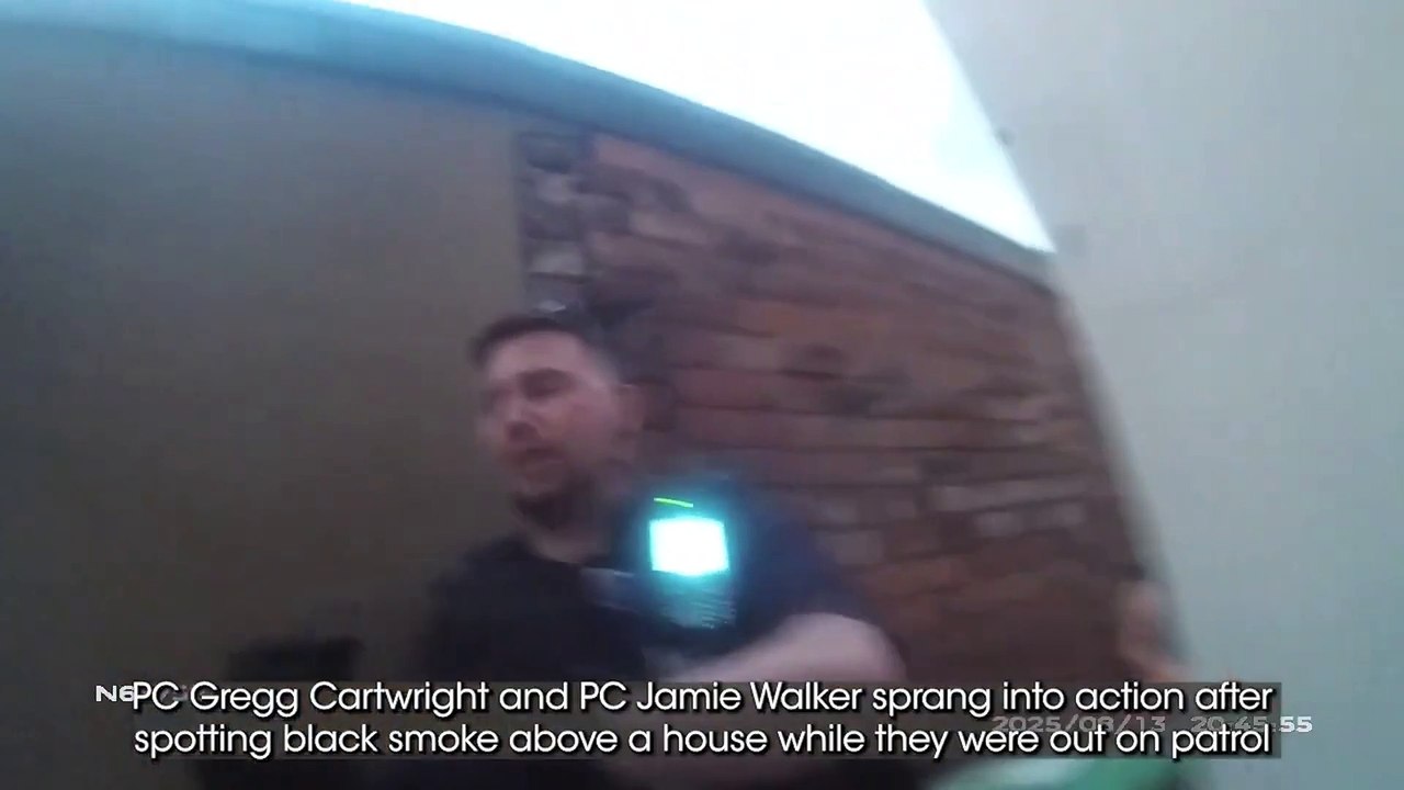 Dramatic moment two hero cops rescued a sleeping woman from a Sutton house fire.