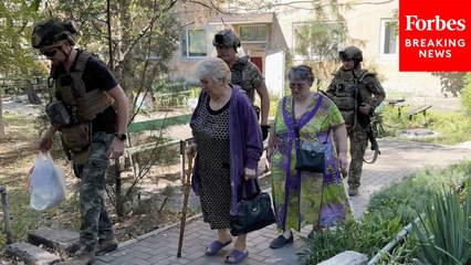 Ukrainian Police Group And NGO Workers Evacuate Civilians From Dobropilia