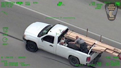 Wild police chase as man in back of pick-up hurls wooden boards at cops before multi-car wrong way crash on highway