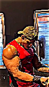 A gym enthusiast is doing an intense workout to strengthen his arm muscles.