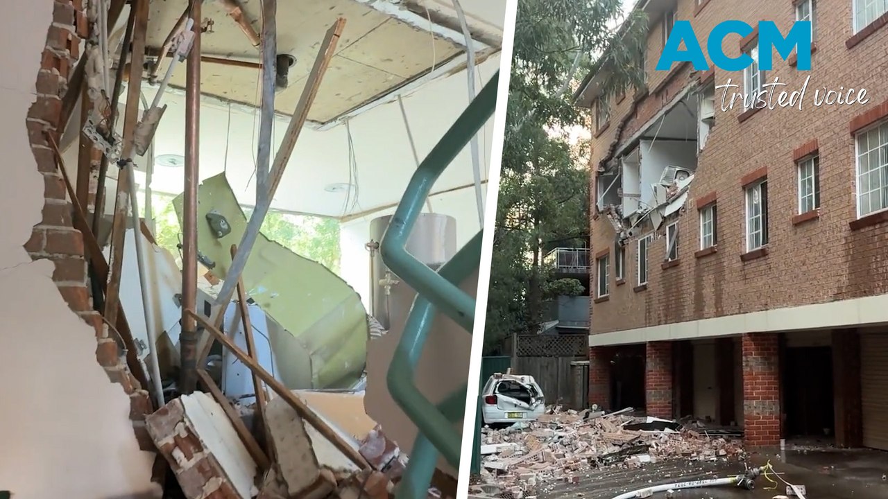 Two hospitalised after explosion blows out apartment block wall