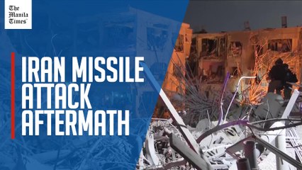Israeli rescuers sort through rubble after Iranian missile attack.