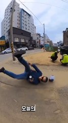 Man Falls Off Skateboard While Riding on Road