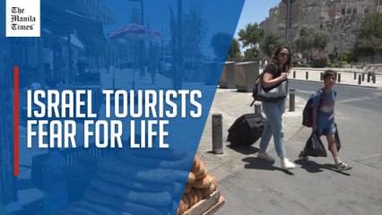 Tourists stranded in Israel as missiles fly, planes grounded