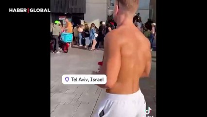 Tel Aviv'de plajda güneşlenen İsrailliler İran füzelerinden böyle kaçtı