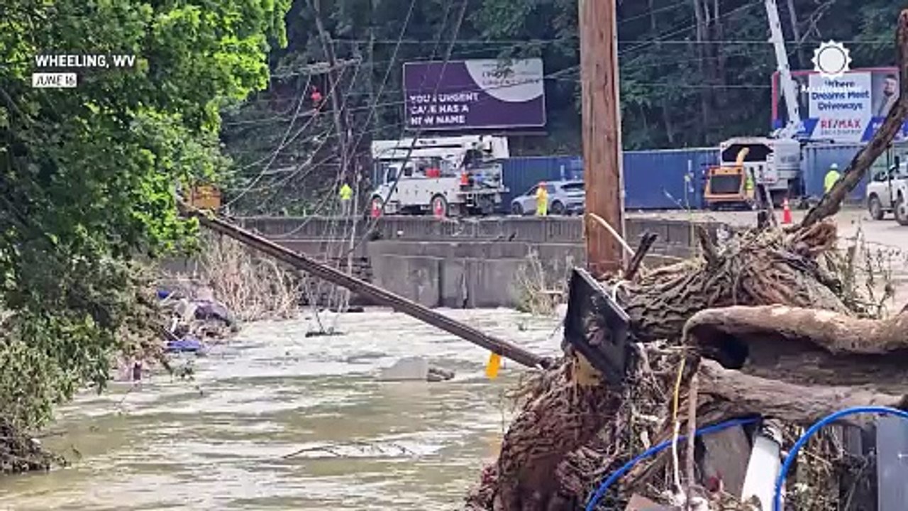 Flooding collapses buildings, destroys cars