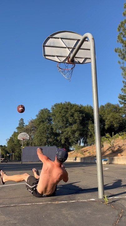 Man Nails Rugby Ball Shot Into Basketball Hoop While Lying Down