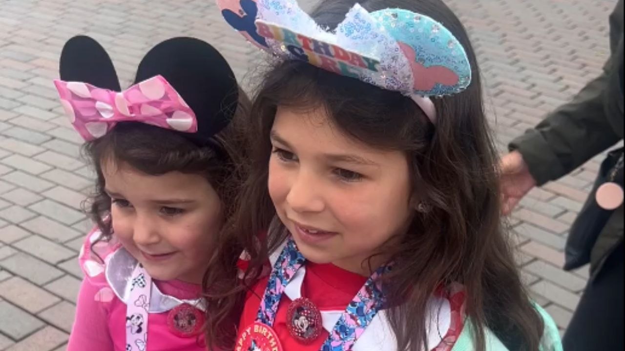 Heartwarming moment girls spot grandparents during surprise trip to Disneyland