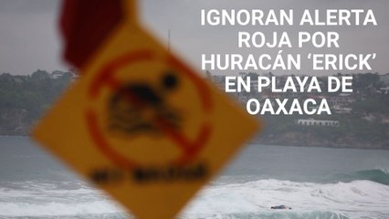 Pese a la aproximación del huracán ‘Erick’,  bañistas ignoran bandera roja en playa Zicatela