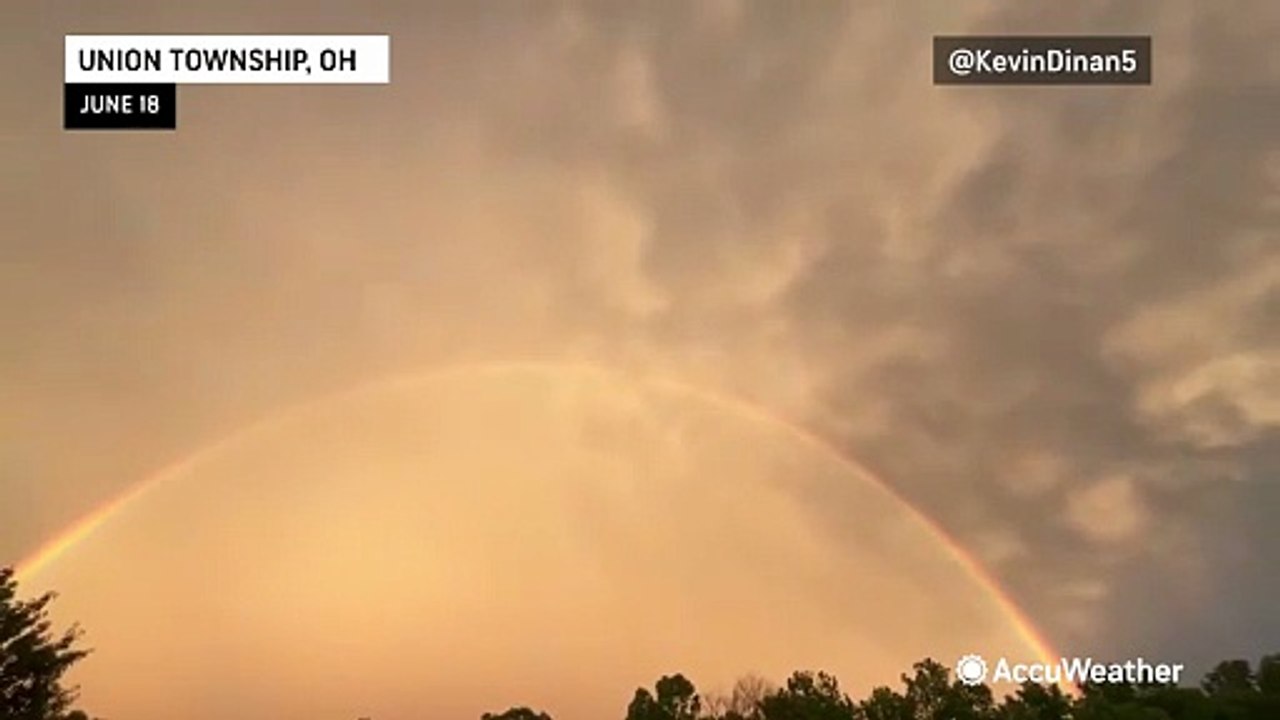 Lightning scatters over rainbow