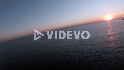 向井聡一　top aerial view of amazing sunset with fishing boat