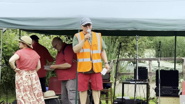 Charlie Werner welcomes visitors to Sandford Millennium Green 25th anniversary picnic, video Alan Quick IMG_4659