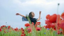 mixkit-girl-dancing-happily-in-a-field-of-flowers-4702-hd-ready